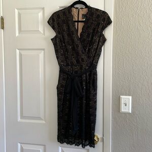 Beautiful dressy evening dress.  Black lace with nude lining.